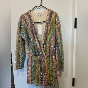 BRAND NEW WITH TAGS. Endless Rose Rainbow Sequin Stripe Romper, Size Small